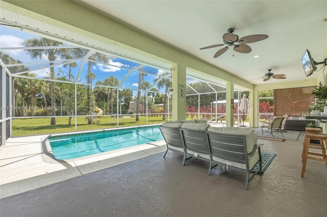 view of pool featuring a lanai, a patio, and ceiling fan