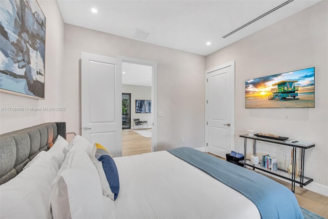 bedroom featuring parquet flooring