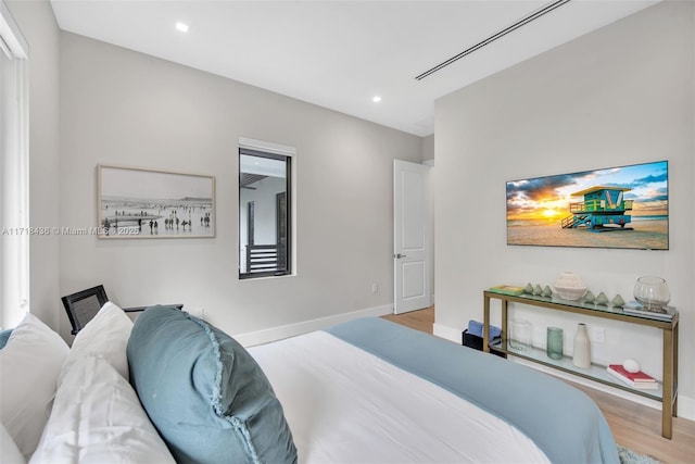 bedroom with light hardwood / wood-style floors