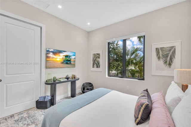 bedroom featuring multiple windows