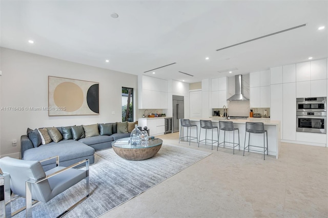 living room featuring sink and beverage cooler