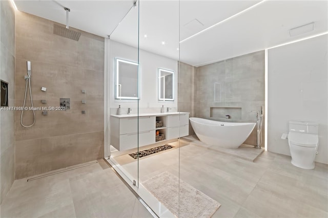 bathroom with vanity, plus walk in shower, and tile walls