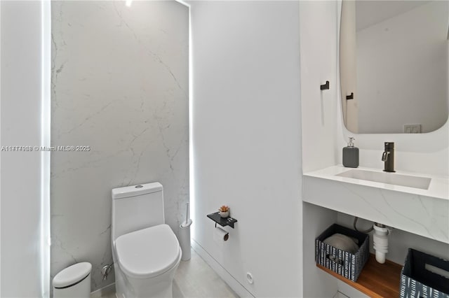 bathroom with toilet and sink