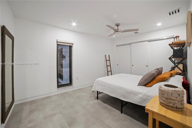 bedroom featuring ceiling fan and a closet