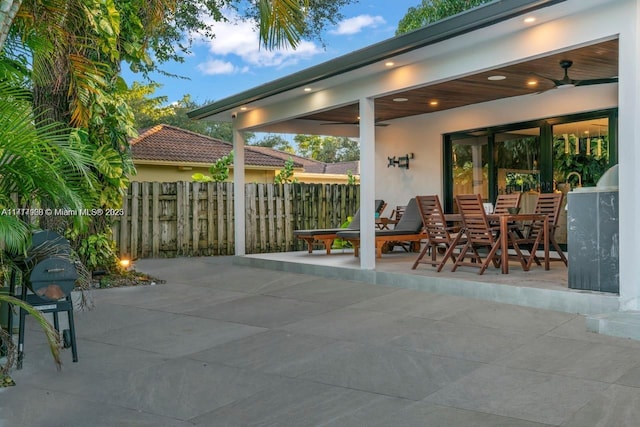 view of patio / terrace with ceiling fan and area for grilling