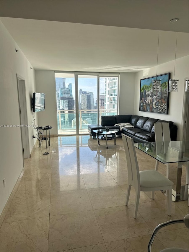 950 Brickell Bay Dr Unit 3505, Miami, FL 33131 - living room with marble finish floor, a wall of windows, and baseboards
