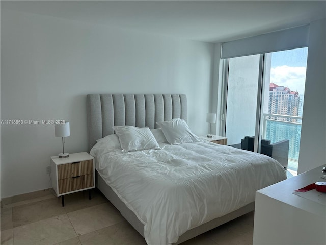 bedroom featuring light tile patterned floors