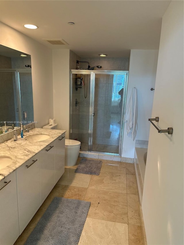 950 Brickell Bay Dr Unit 3505, Miami, FL 33131 - full bathroom with toilet, a sink, a stall shower, visible vents, and double vanity