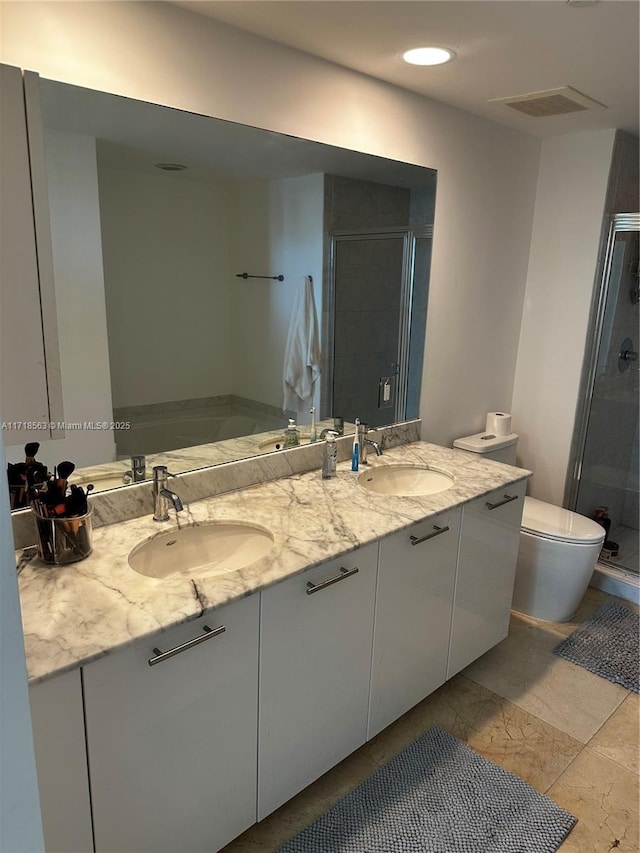 950 Brickell Bay Dr Unit 3505, Miami, FL 33131 - bathroom with double vanity, a sink, a shower stall, and visible vents