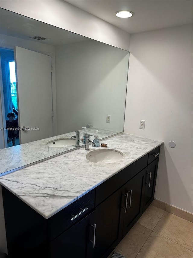 950 Brickell Bay Dr Unit 3505, Miami, FL 33131 - bathroom with marble finish floor, vanity, baseboards, and visible vents