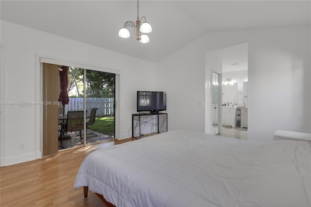 bedroom featuring access to exterior, vaulted ceiling, light hardwood / wood-style flooring, an inviting chandelier, and connected bathroom