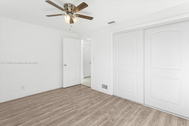 unfurnished bedroom featuring a closet, ceiling fan, and light hardwood / wood-style floors