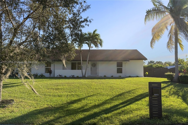 back of house with a lawn