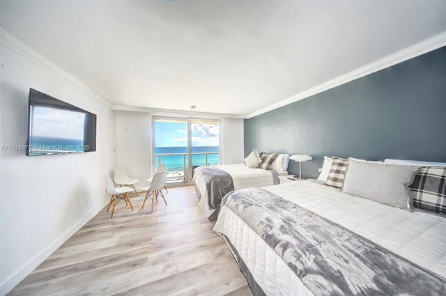 bedroom with light hardwood / wood-style floors, access to exterior, and crown molding