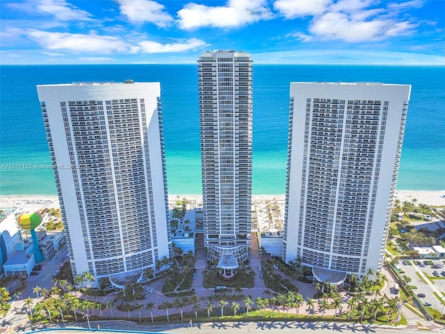 view of property featuring a water view and a view of the beach