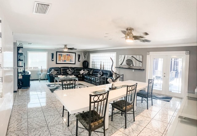 dining area featuring ceiling fan, french doors, and ornamental molding