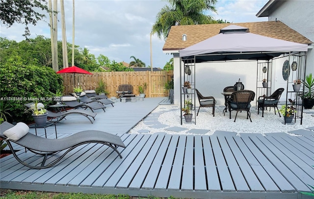 wooden deck with a gazebo