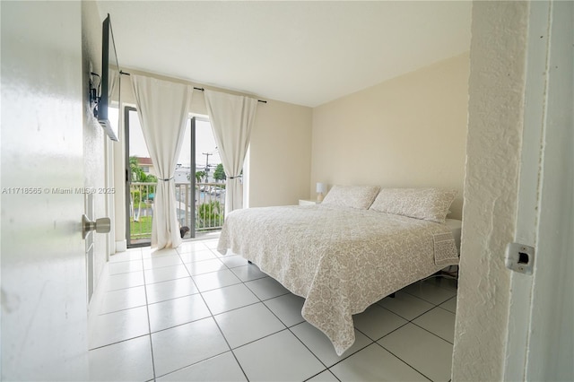 tiled bedroom with access to outside