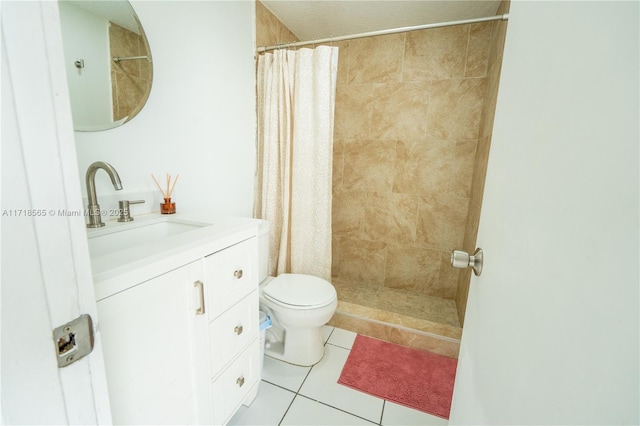 bathroom featuring tile patterned flooring, vanity, toilet, and a shower with curtain