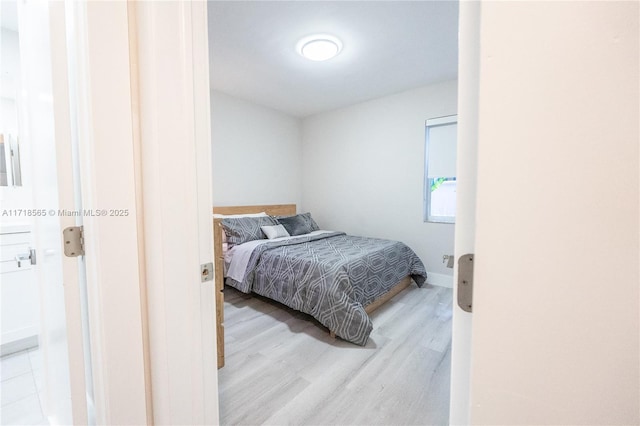 bedroom with light hardwood / wood-style floors