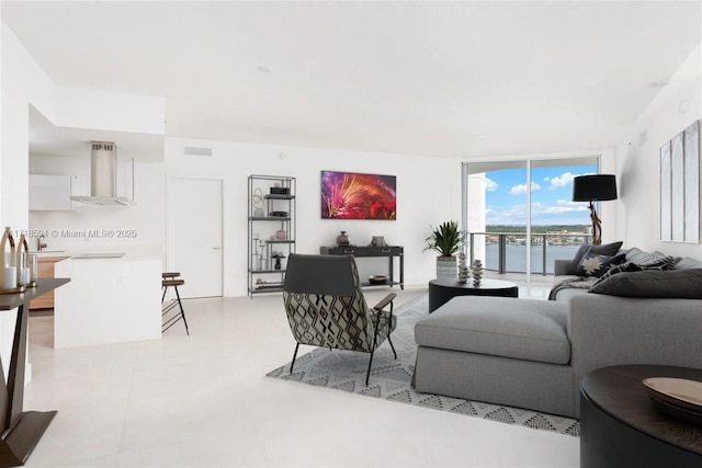 living room featuring floor to ceiling windows