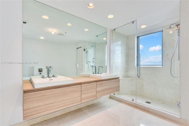 bathroom featuring tile patterned floors, vanity, and an enclosed shower