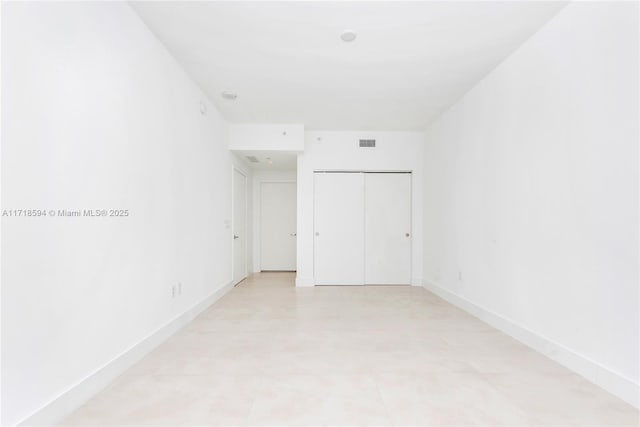 unfurnished bedroom featuring a closet