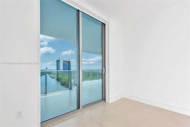 empty room featuring a wall of windows