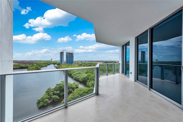 balcony featuring a water view