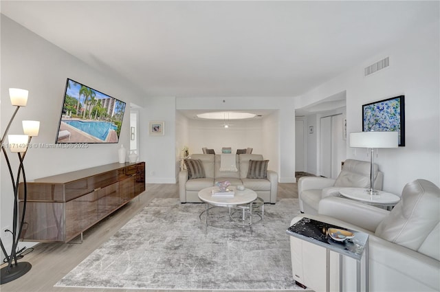 living room with light hardwood / wood-style floors