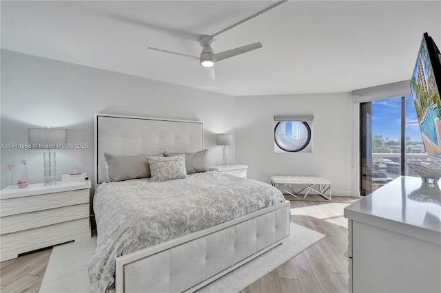 bedroom with ceiling fan, access to exterior, and light hardwood / wood-style flooring