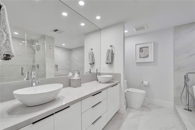 bathroom featuring an enclosed shower, vanity, and toilet