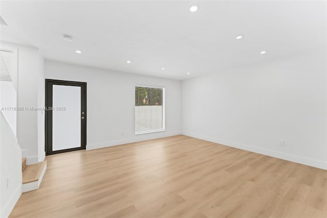 stairs featuring hardwood / wood-style flooring