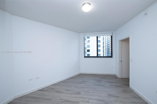 unfurnished room featuring light hardwood / wood-style flooring