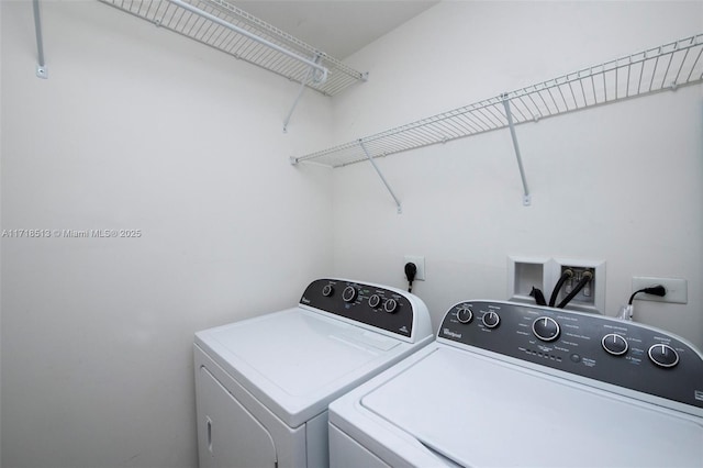 laundry room with independent washer and dryer