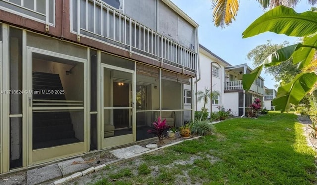 view of side of home featuring a lawn