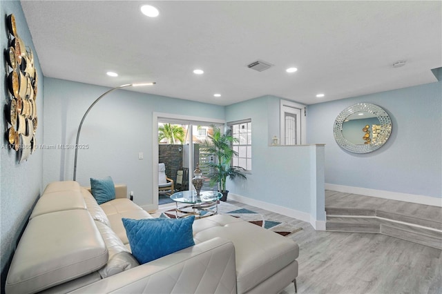 living room with light hardwood / wood-style flooring