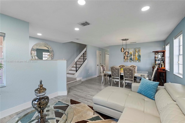 living room with light hardwood / wood-style floors