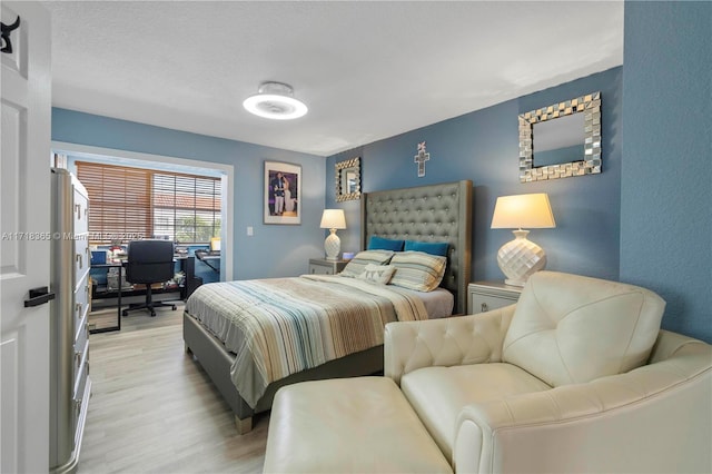 bedroom with light hardwood / wood-style floors