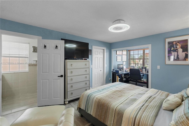 bedroom with wood-type flooring