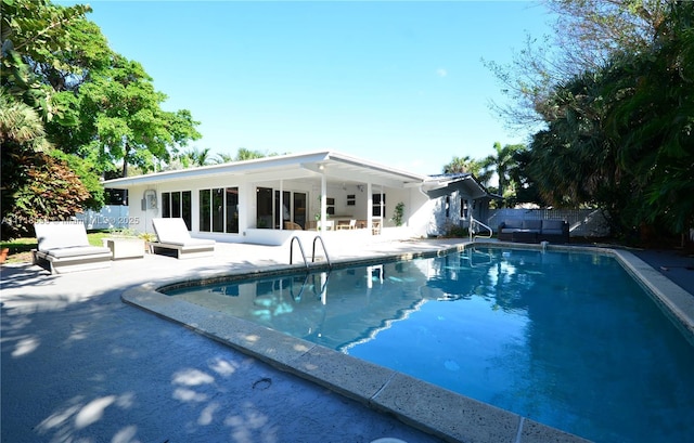 view of swimming pool featuring a patio area