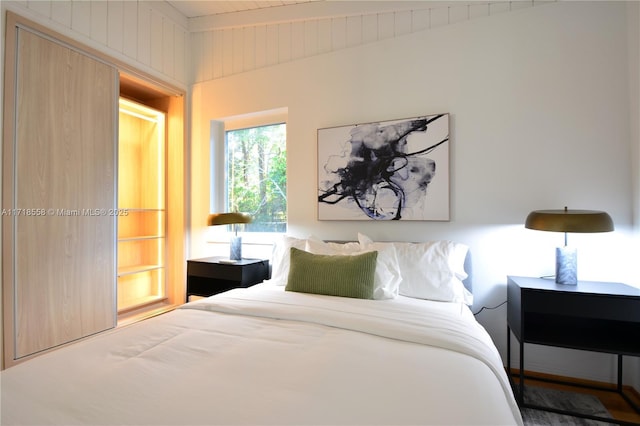 bedroom with beam ceiling