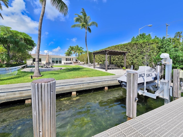 dock area featuring a pergola, a water view, and a lawn