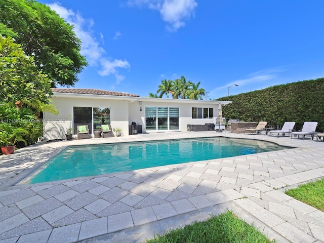 view of swimming pool with a patio