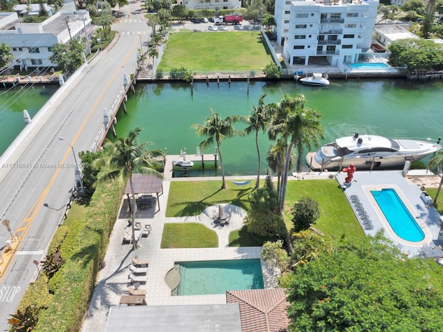 birds eye view of property with a water view