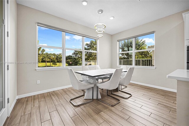 dining area featuring a notable chandelier