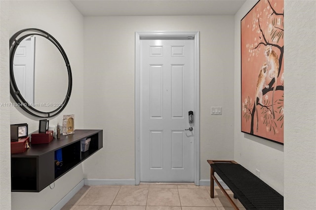 entryway with light tile patterned floors