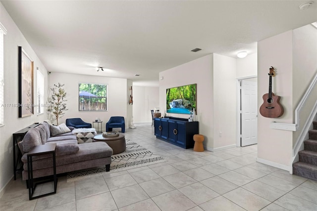 living room with light tile patterned floors