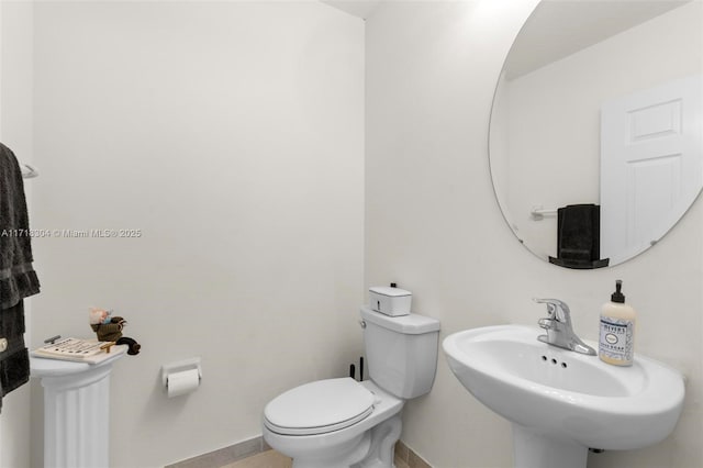 bathroom with toilet and sink