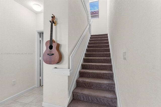 stairs with tile patterned flooring